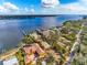 Spectacular aerial view of the home, waterway, and surrounding area at 7825 Manasota Key Rd, Englewood, FL 34223