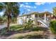 Charming Florida home with attached garage and palm trees at 7825 Manasota Key Rd, Englewood, FL 34223