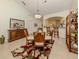 Bright dining room with wood furniture and area rug at 784 Tartan Dr # 784, Venice, FL 34293