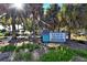 Venice Beach access point with signage and lush landscaping at 887 Morgan Towne Way, Venice, FL 34292