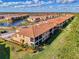Aerial view of community, highlighting homes and landscape at 10039 Crooked Creek Dr # 203, Venice, FL 34293