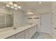 Bathroom featuring dual sinks, a long vanity and a shower at 10039 Crooked Creek Dr # 203, Venice, FL 34293