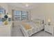 Comfortable bedroom with a queen-size bed and ample natural light at 10039 Crooked Creek Dr # 203, Venice, FL 34293