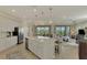 Beautiful open kitchen and living room with stainless appliances and a neutral color palette at 10039 Crooked Creek Dr # 203, Venice, FL 34293