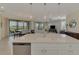 Open concept kitchen with island overlooking living room at 10039 Crooked Creek Dr # 203, Venice, FL 34293