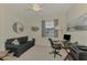 Comfortable home office with desk and couch at 10039 Crooked Creek Dr # 203, Venice, FL 34293
