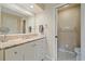 Bathroom with white vanity, granite countertop, and mirror at 1211 Capri Isles Blvd # 58, Venice, FL 34292