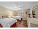 Cozy bedroom with two twin beds, white furniture, and wood-look flooring at 1211 Capri Isles Blvd # 58, Venice, FL 34292