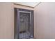 Welcoming front entry with screened door and decorative welcome mat at 1211 Capri Isles Blvd # 58, Venice, FL 34292