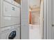 In-unit laundry with stacked washer and dryer at 1211 Capri Isles Blvd # 58, Venice, FL 34292