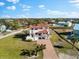 Bird's-eye view showcasing the home's location, landscaping, and proximity to other properties at 130 Green Dolphin Dr, Placida, FL 33946