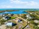 Stunning aerial view of the home, waterfront location, and surrounding neighborhood at 130 Green Dolphin Dr, Placida, FL 33946