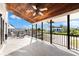 Relaxing balcony with seating, tiled flooring, and black railing overlooking the neighborhood at 130 Green Dolphin Dr, Placida, FL 33946