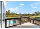 Relaxing balcony overlooking the pool, backyard, and surrounding greenery at 130 Green Dolphin Dr, Placida, FL 33946
