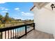Balcony with black railing offering views of the pool and backyard at 130 Green Dolphin Dr, Placida, FL 33946