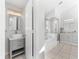 Modern bathroom featuring a vanity, soaking tub, and glass-enclosed shower at 130 Green Dolphin Dr, Placida, FL 33946