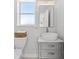 Stylish bathroom with a modern vessel sink, updated vanity, and window at 130 Green Dolphin Dr, Placida, FL 33946