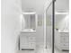 White bathroom with vanity, mirror, and sliding closet doors at 130 Green Dolphin Dr, Placida, FL 33946