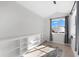 Bright bedroom with built-in shelving, large window, and decorative rug at 130 Green Dolphin Dr, Placida, FL 33946