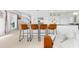 View of the kitchen's bar seating area and adjacent living space at 130 Green Dolphin Dr, Placida, FL 33946