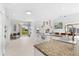 Bright, open kitchen with white cabinetry, granite countertops, and stainless steel appliances at 130 Green Dolphin Dr, Placida, FL 33946