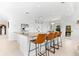Stylish kitchen with white cabinets, granite countertops, and bar seating at 130 Green Dolphin Dr, Placida, FL 33946