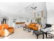 Open-concept living area with vaulted ceilings, comfortable seating, and modern decor at 130 Green Dolphin Dr, Placida, FL 33946