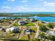 Scenic waterfront neighborhood with lush greenery, multiple homes, and nearby water at 130 Green Dolphin Dr, Placida, FL 33946