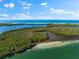 Stunning aerial view of the coastline, featuring crystal-clear waters and islands at 130 Green Dolphin Dr, Placida, FL 33946