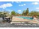 Outdoor living space with a pool, patio furniture, and fenced yard, ideal for entertaining at 130 Green Dolphin Dr, Placida, FL 33946
