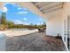 Inviting pool area with paver patio, covered seating area, and lush landscaping at 130 Green Dolphin Dr, Placida, FL 33946