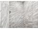 Modern shower with marble tile and pebble floor at 130 Green Dolphin Dr, Placida, FL 33946