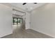 Bedroom with view into living area and sliding doors at 1303 Cathedall Ave, North Port, FL 34288