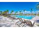 Lounge chairs surround a large resort-style community pool at 13940 Miranese St, Venice, FL 34293