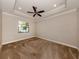 Spacious bedroom with carpeted floor and ceiling fan at 148 Maraviya Blvd, Nokomis, FL 34275