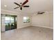 Bright living room with water views and sliding glass doors at 148 Maraviya Blvd, Nokomis, FL 34275