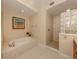 Elegant bathroom with a separate shower and soaking tub, perfect for relaxation at 157 Tampa E Ave # 807, Venice, FL 34285