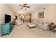 Living area with comfortable seating, a TV, and a view into the dining area at 157 Tampa E Ave # 807, Venice, FL 34285