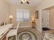 Bright home office with white desk, comfortable seating, and coastal decor at 157 Tampa E Ave # 807, Venice, FL 34285
