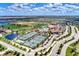 Aerial view of community amenities including tennis courts and clubhouse at 17118 Vardon Ter # 202, Bradenton, FL 34211