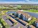 Condo building aerial view, showcasing parking and landscaping at 17118 Vardon Ter # 202, Bradenton, FL 34211