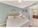 Comfortable bedroom features a ceiling fan, artwork, and soft, natural lighting at 17118 Vardon Ter # 202, Bradenton, FL 34211