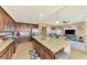 Bright kitchen area overlooking living room and features granite countertops and stainless appliances at 17118 Vardon Ter # 202, Bradenton, FL 34211