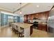 Modern kitchen with a large island, granite countertops, and stainless steel appliances at 17118 Vardon Ter # 202, Bradenton, FL 34211