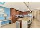Well-equipped kitchen with stainless steel appliances, granite counters, and a breakfast bar at 17118 Vardon Ter # 202, Bradenton, FL 34211