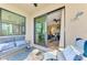 Relaxing patio with water views, seating and access to interior living space at 17118 Vardon Ter # 202, Bradenton, FL 34211