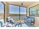 Inviting screened-in patio with golf course water views and comfortable seating at 17118 Vardon Ter # 202, Bradenton, FL 34211
