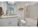 Bathroom with granite countertop, bathtub, and shower at 1836 W Isles Rd, Port Charlotte, FL 33953