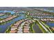 Aerial perspective of a neighborhood with houses, interconnected waterways, and lush landscaping at 19225 Jacinda St, Venice, FL 34293