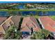 Aerial view of a luxury home community with water features and lush landscaping at 19279 Jacinda St, Venice, FL 34293